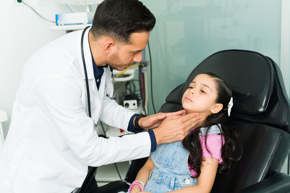doctor checking a girl for strep throat in kid in Rockville