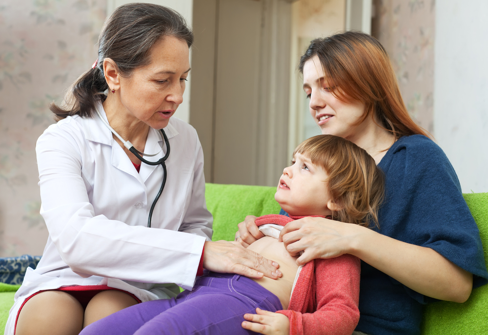 doctor treating tummy ache for kid in Rockville